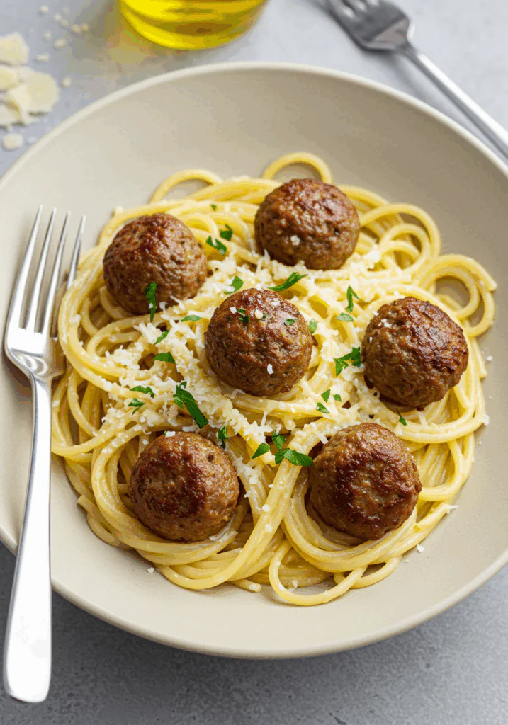 Garlic Butter Meatballs over Creamy Parmesan Linguine